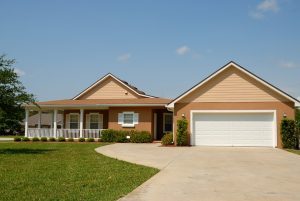Tampa beige color House with garage and landscape