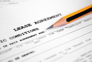 Lease Agreement file with a pencil on top