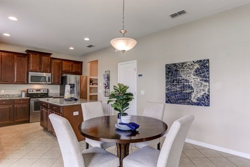 A kitchen and dining area near where where you can hire a Tampa property manager from Hoffman Realty