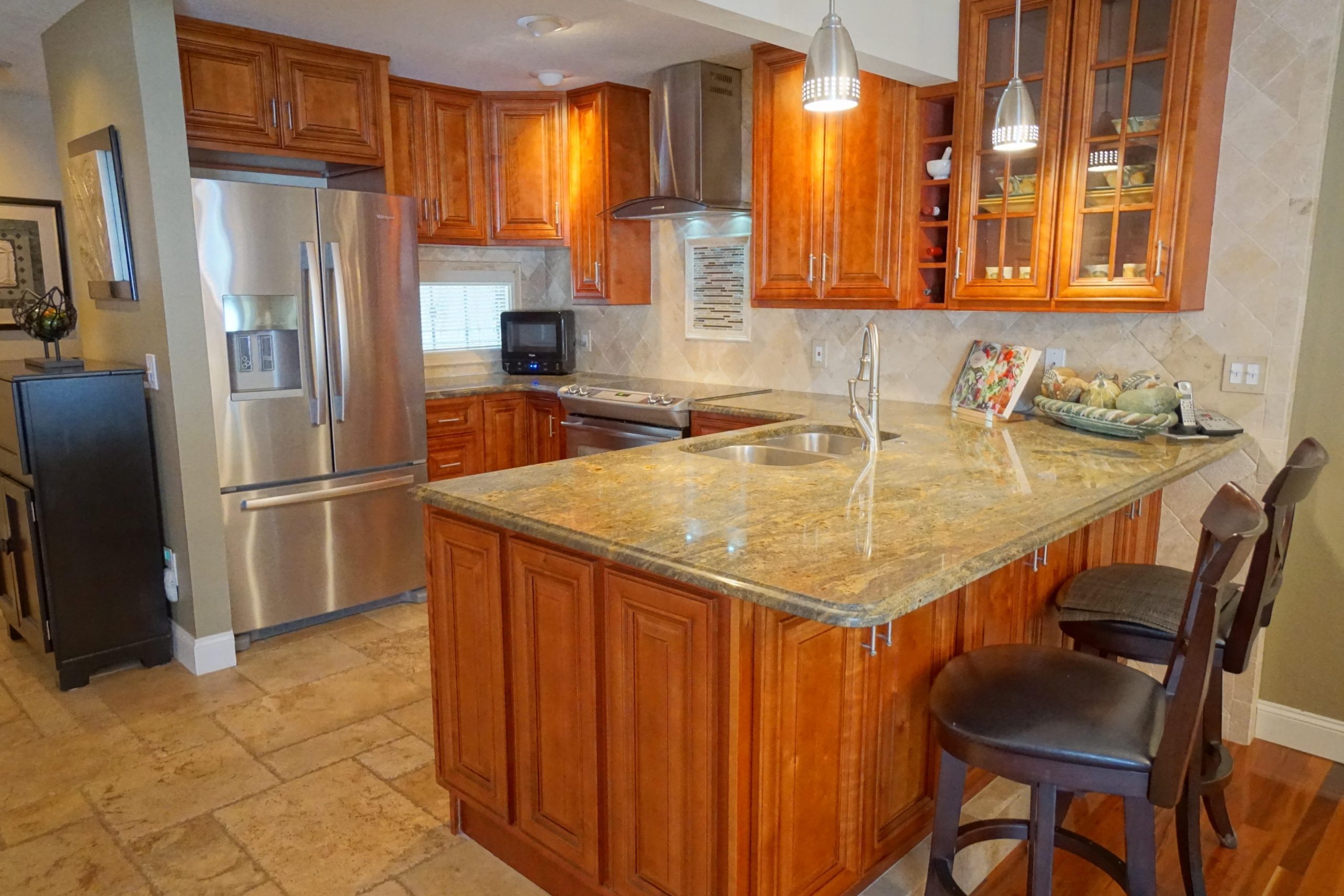 Kitchen with sink and counter and a refrigerator