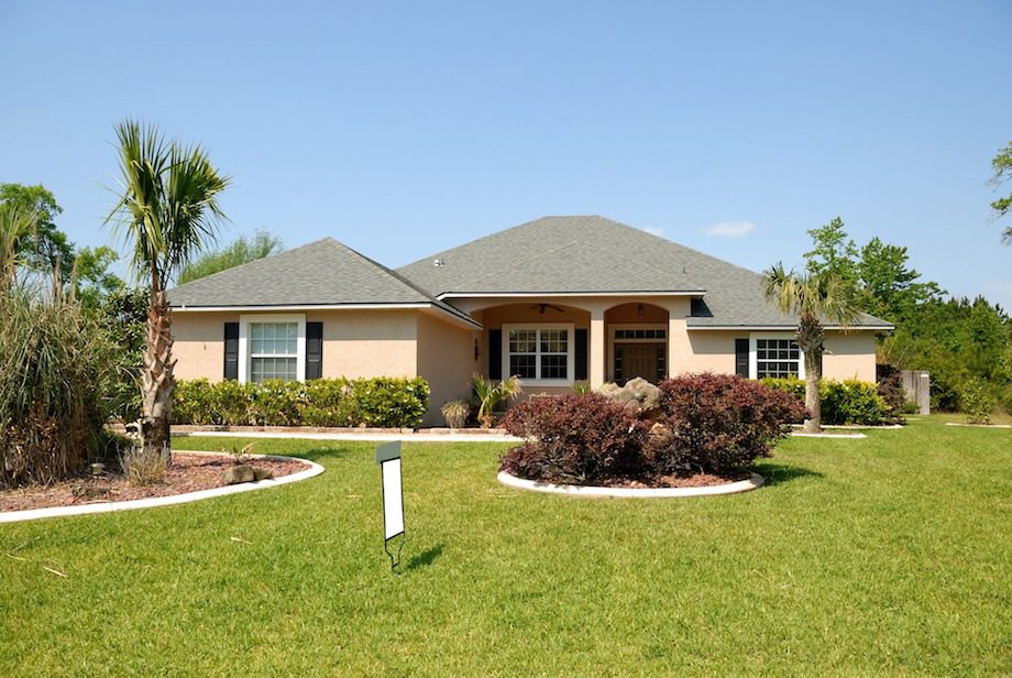 Two beige townhomes with a red trim near where Hoffman Realty provides Brandon property management